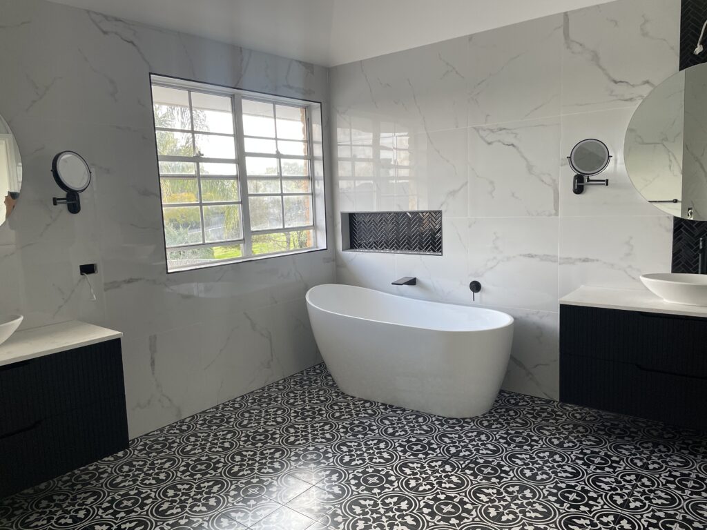 A clean, modern style Sydney bathroom remodel in white, black and gray