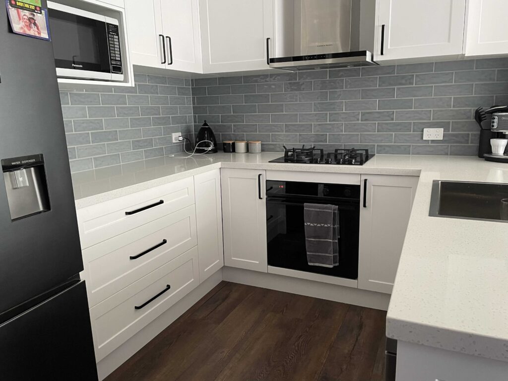 cabinetry and appliances for a small budget kitchen reno by Empire Tiles